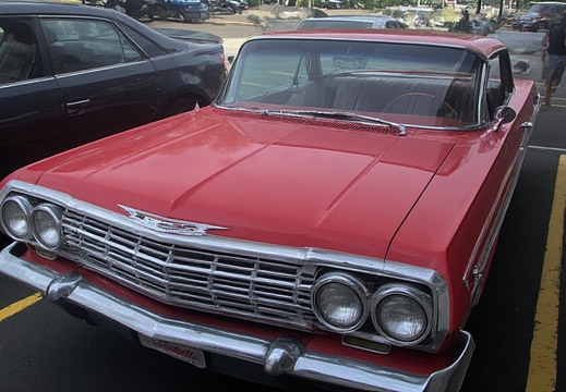 Front end of a classic red Chevrolet Impala