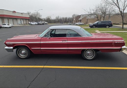 Side profile of a vintage two-door car