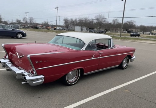 A classic red and white Chevrolet Bel Air from the 1950s